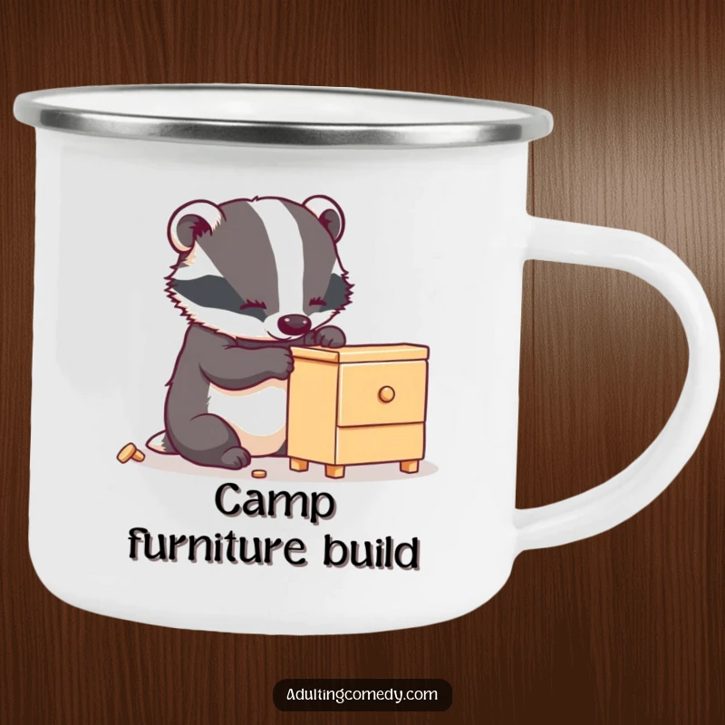 Funny badger camping mug showing a busy animal carefully assembling wobbly furniture, great for outdoor gifts.