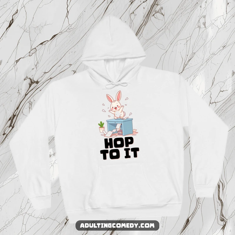 Funny Bunny Hoodie: A playful bunny causing delightful destruction on a miniature desk, scattering papers with glee, offering cozy humor and a great gift.