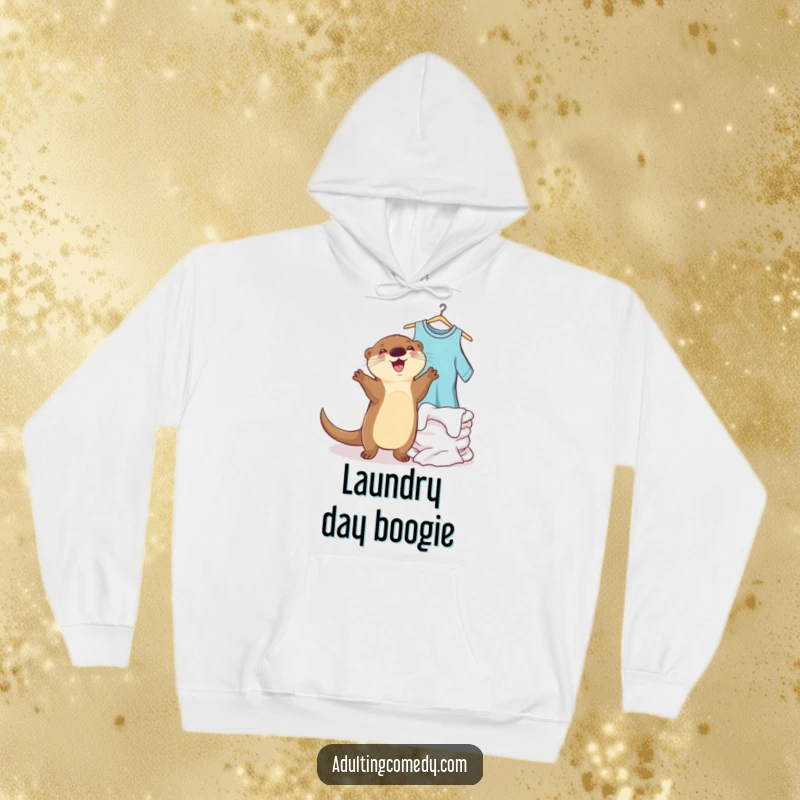 Funny otter hoodie showing a joyful creature dancing happily next to a pile of clean laundry, a cozy funny gift.