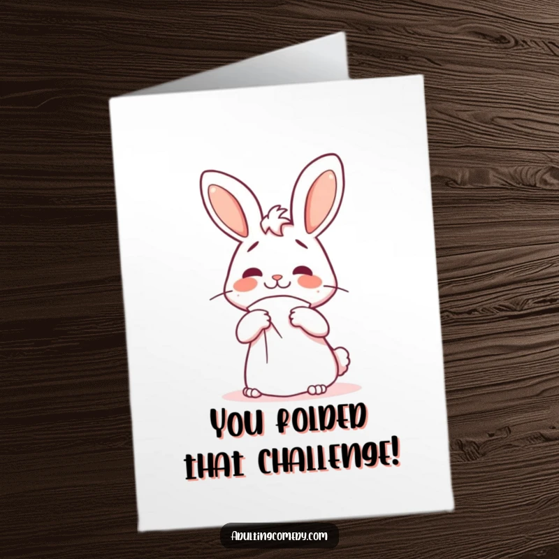 Funny Free Printable Congratulations Card: Confused bunny attempting to fold a giant napkin, a humorous DIY congratulations.